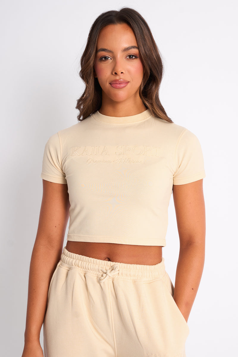 Kaiia Sport Baby Tee Buttercream